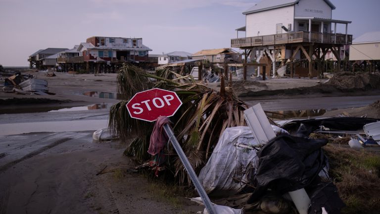 A stop sign lies damaged at a street corner in the aftermath of Hurricane Ida in Grand Isle, Louisiana, U.S., September 2, 2021. REUTERS/Adrees Latif
