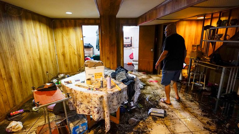 Felix Delapuente, a neighbor of the home in the Queens borough of New York where three people died including a 2-year old child, shows the flood damage in his basement, Thursday, Sept. 2, 2021, in New York 
PIC:AP