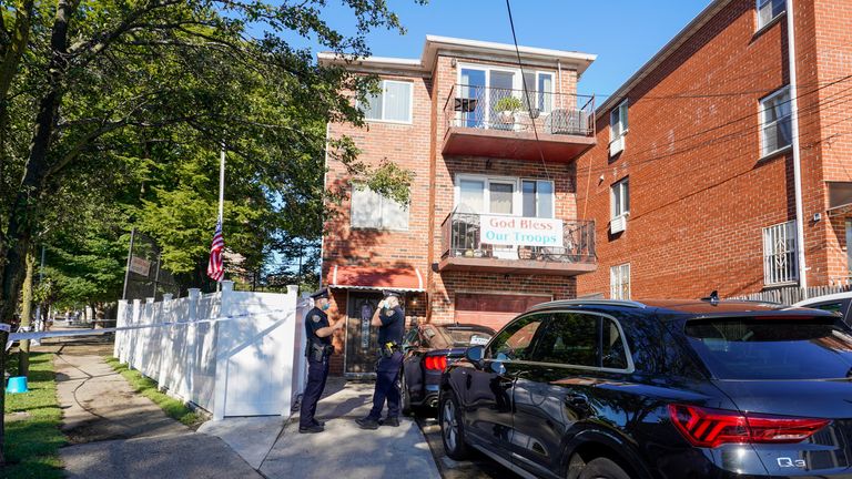 Police officers stand outside a home in the Queens borough of New York where three people died including a 2-year old child when their basement apartment flooded, Thursday, Sept. 2, 2021, in New York
PIC:AP