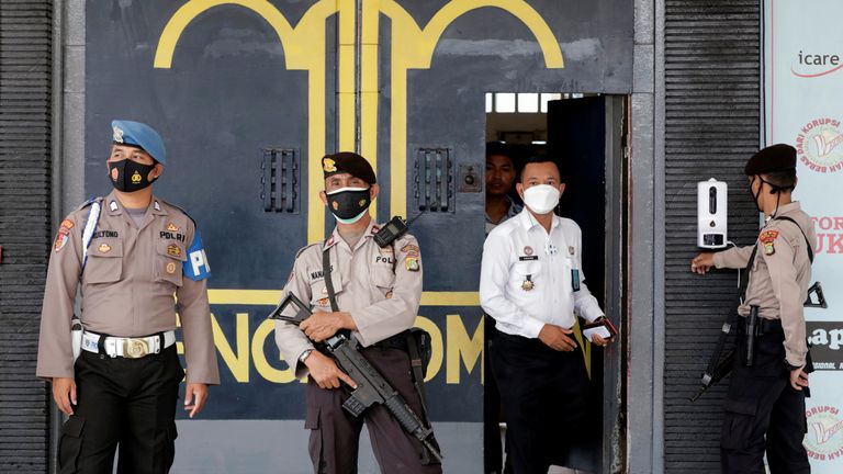 Police officers at the main entrance gate of Tangerang prison 