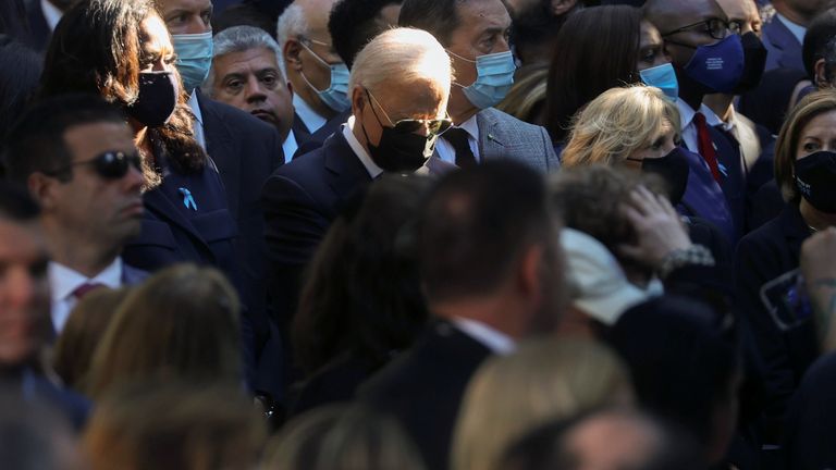 President Joe Biden bows his head at the ceremony in New York