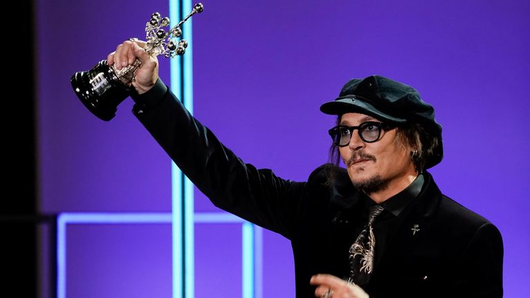 Actor Johnny Depp holds the Donostia Award at the 69th San Sebastian International Film Festival in Spain