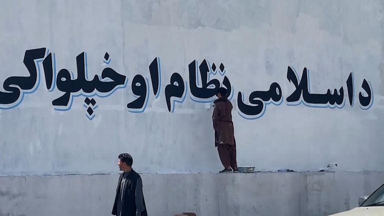 The Taliban has started covering murals and images painted on the security wall around Kabul with white paint and replacing them with short sentences supporting their ideology.

