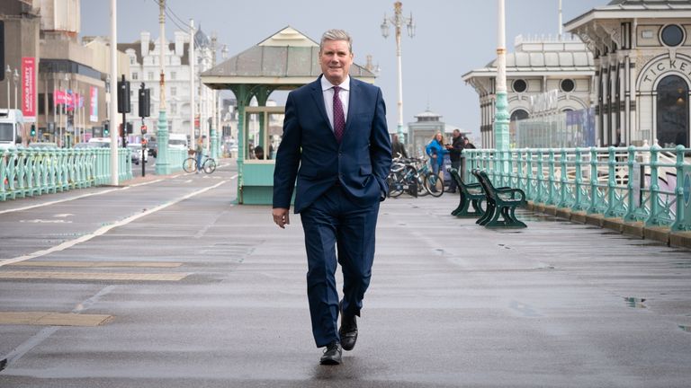 Labour leader Sir Keir Starmer walks along Brighton seafront promenade during the Labour Party conference in Brighton. Picture date: Tuesday September 28, 2021.