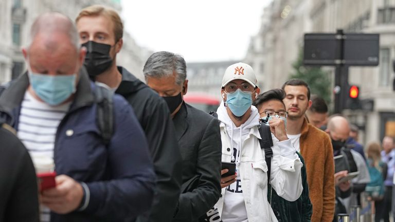 Customers queue to buy the new Apple iPhone 13 outside the tech giant&#39;s flagship store in Regent Street, central London.