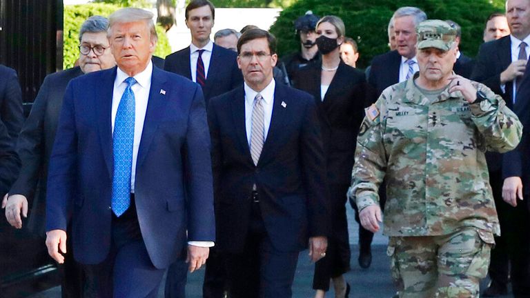 President Donald Trump outside the White House in June 2020 with officials including Gen Mark Milley (R)