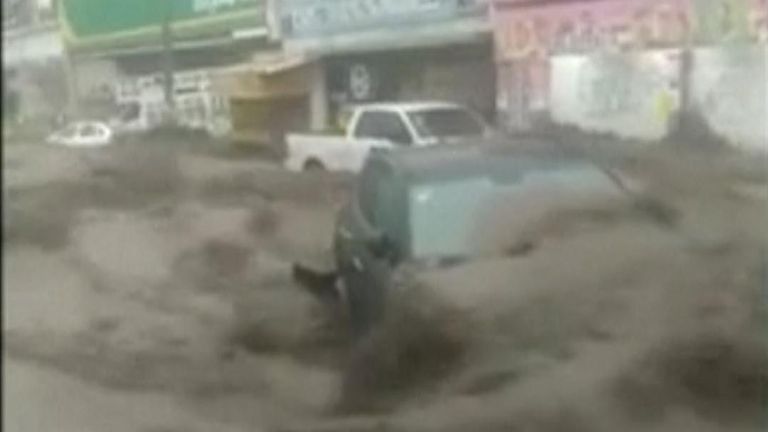 Cars being swept away in Mexican floods