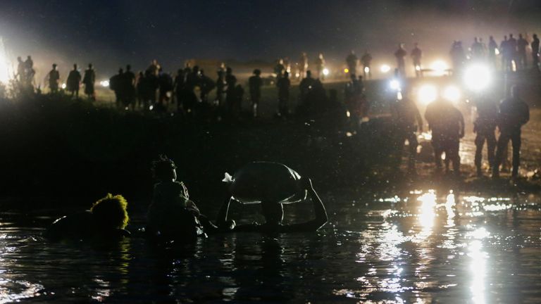 Migrants seeking refuge in the U.S., cross the Rio Grande river from Mexico towards Del Rio, Texas, U.S., as seen from Ciudad Acuna, Mexico 