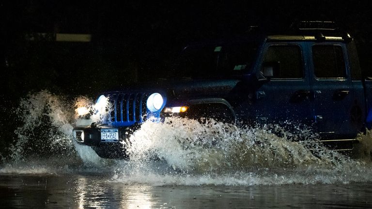 A massive tropical storm hits The NYC area creating flooding and stranding cars in Staten Island, New York.  PIC:AP