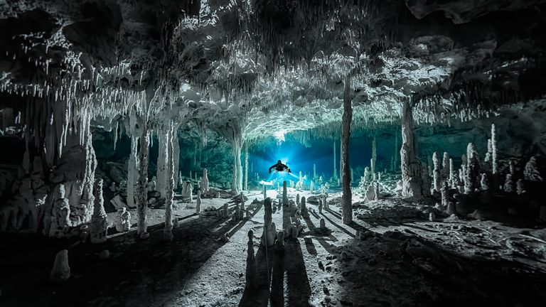 Speleothems cast long shadows at cenote Dos Pisos, Quintana Roo, Mexico. Pic: Martin Broen/Ocean Photography Awards
