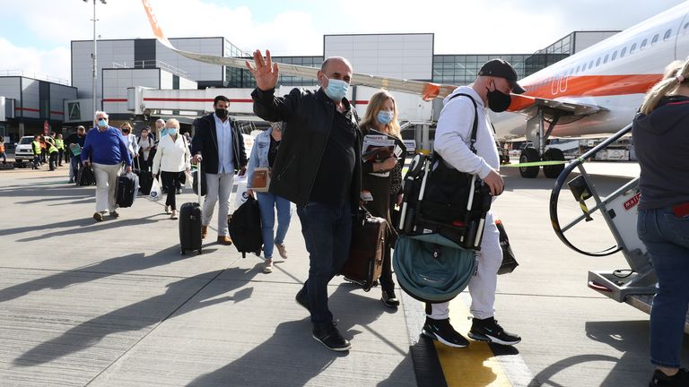 Passengers prepare to board an easyJet flight to Faro, Portugal, at Gatwick Airport in West Sussex after the ban on international leisure travel for people in England was lifted following the further easing of lockdown restrictions.