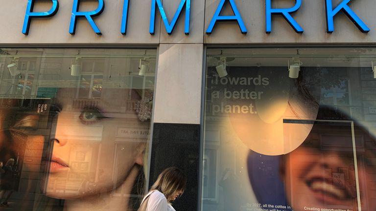 A woman walks past a window display showing new environmentally themed posters at a Primark store in Liverpool
A woman walks past a window display showing new environmentally themed posters at a Primark store in Liverpool, Britain, September 15, 2021. REUTERS/Phil Noble