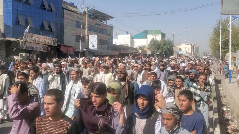 People hold a protest march against the Taliban's decision to force them to leave their homes in Kandahar, Afghanistan