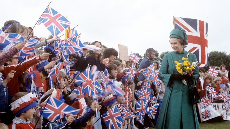 1978
Queen Elizabeth II at a gathering of schoolchildren at Grainville, Saint Saviour, as she and the Duke of Edinburgh visited the island of Jersey, Channel Islands.