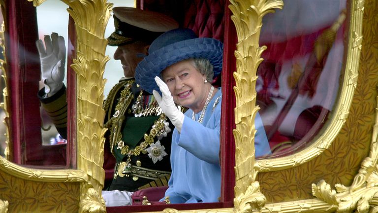 The Queen waves to the crowd as she celebrates her Golden Jubilee.