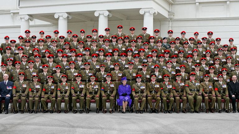 Posing with the Royal Military Police for a family photo in 2007