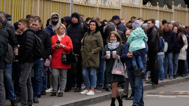 People stand in line to a polling station during parliamentary elections in Moscow, Russia, Friday, Sept. 17, 2021. Russia has begun three days of voting for a new parliament that is unlikely to change the country&#39;s political complexion. There&#39;s no expectation that United Russia, the party devoted to President Vladimir Putin, will lose its dominance in the State Duma. 
PIC:AP