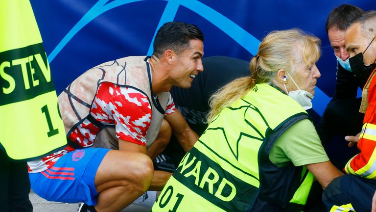 Cristiano Ronaldo makes steward's year by gifting shirt after hitting her  with ball during warm-up to Manchester United's Champions League defeat to  Young Boys