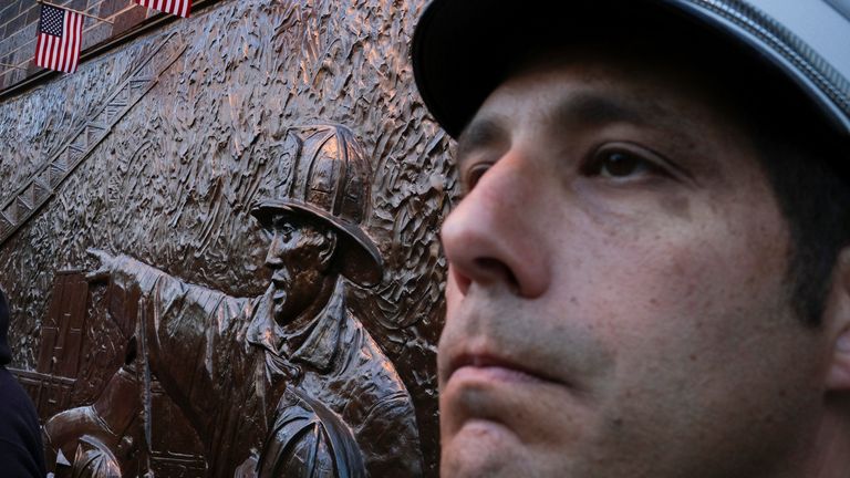 A firefighter looks on before the ceremonies get underway