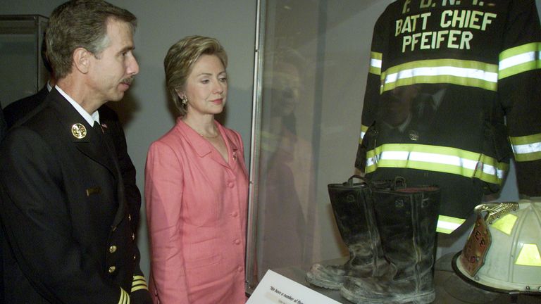 Chief Pfiefer, and then New York Senator Hilary Clinton, as his equipment is displayed at the Museum of American History on 10 September 2002