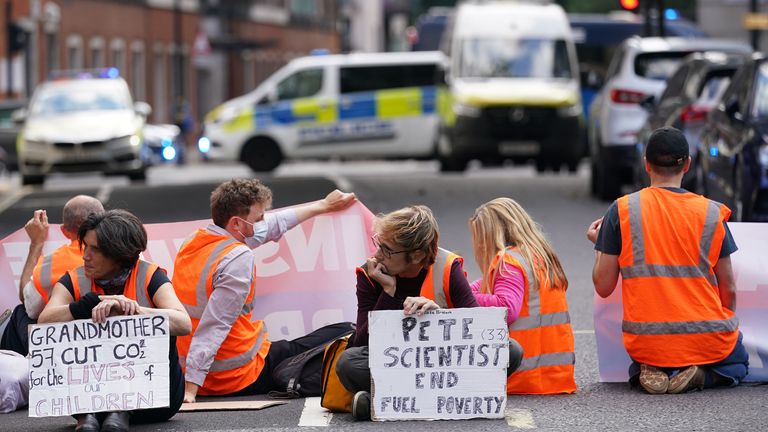 Protesters from Insulate Britain block a road outside the Home Office in central London. Picture date: Wednesday September 22, 2021.