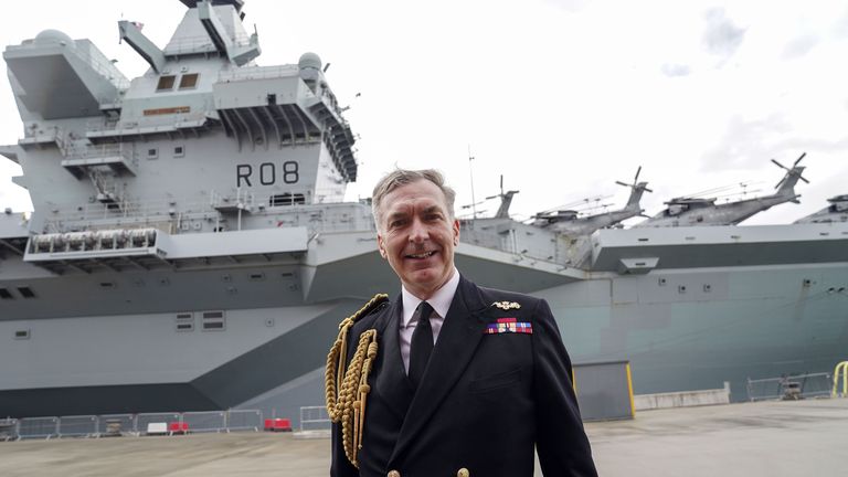 First Sea Lord Admiral Tony Radakin talks to. media in front of the HMS Queen Elizabeth