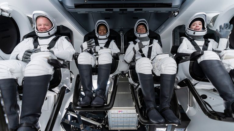 Chris Sembroski, Sian Proctor, Jared Isaacman and Hayley Arceneaux sit in the Dragon capsule