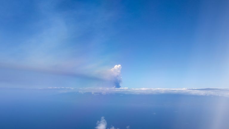 A cloud of smoke from an erupted volcano in Cumbre Vieja National Park, on the Canary Islands of La Palma, Spain, is seen from a plane