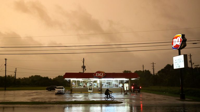A Dairy Queen in Bay City stays open as customers try to get in a meal before it closes as Tropical Storm Nicholas approaches on Monday, Sept. 13, 2021.