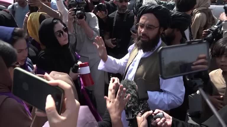 Members of the Taliban wade into crowds of protesting women in Kabul on Saturday
