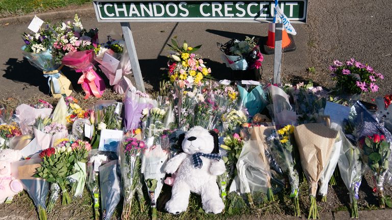 Floral tributes at the scene in Chandos Crescent in Killamarsh, near Sheffield, where four people were found dead at a house on Sunday. Derbyshire Police said a man is in police custody and they are not looking for anyone else in connection with the deaths. Picture date: Monday September 20, 2021.