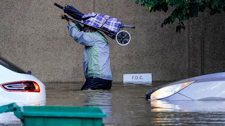 A person walks in floodwaters in Philadelphia, Thursday, Sept. 2, 2021 in the aftermath of downpours and high winds from the remnants of Hurricane Ida that hit the area.
PIC:AP