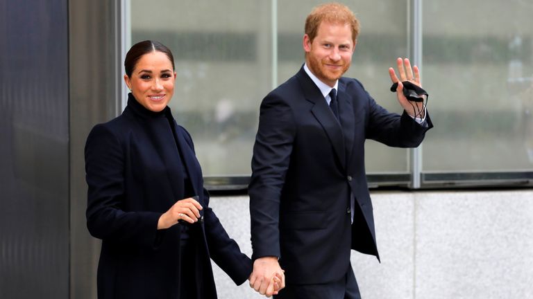 Britain&#39;s Prince Harry and Meghan, Duke and Duchess of Sussex, wave while visiting the 9/11 Memorial in Manhattan, New York City, U.S., 