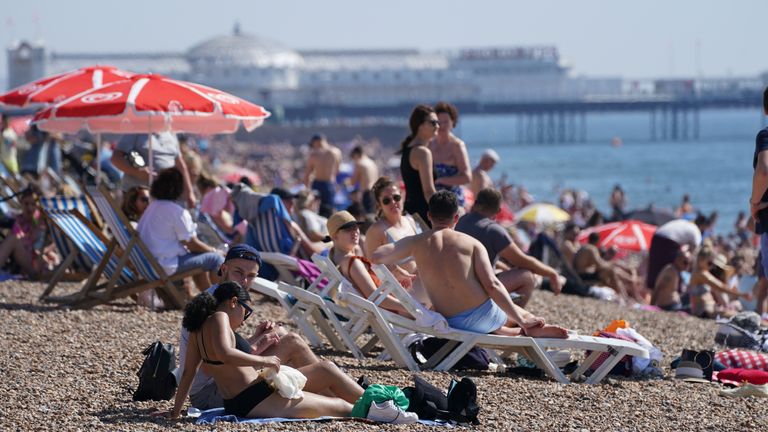 People enjoy the warm weather at Brighton beach in West Sussex. Temperatures are forecast to reach up to 30C in parts of the UK on Tuesday as the country enjoys a warm start to September. Picture date:  September 7,