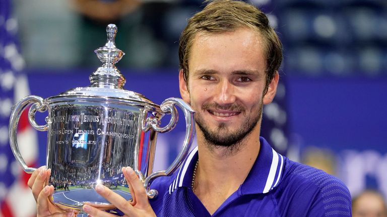Daniil Medvedev, of Russia, holds up the championship trophy after defeating Novak Djokovic, of Serbia, in the men...s singles final of the US Open tennis championships, Sunday, Sept. 12, 2021, in New York. (AP Photo/John Minchillo) 