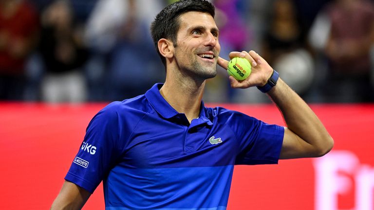Novak Djokovic throws a ball to fans after a Men&#39;s Singles match at the 2021 US Open, Thursday, Sep. 2, 2021 in Flushing, NY. (Garrett Ellwood/USTA via AP)