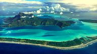 Stunning view of Bora Bora Island just before landing there. French Polynesia, South Pacific Ocean.