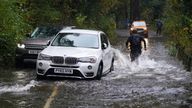 A broken down car in floodwater near Derwentwater, Keswick in Cumbria, where the Met office has warned of life-threatening flooding and issued amber weather warnings as the area was lashed with "persistent and heavy rain". Up to 300mm is expected to fall in parts of the region, which typically sees an average of 160mm in October. Picture date: Thursday October 28, 2021.
