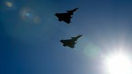 Two French Rafale fighter jets perform a flyover during a joint military drill