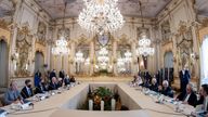 US President Joe Biden, middle left, meets with Italian President Sergio Mattarella, middle right, ahead of the G20 summit