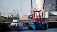 The French Gendarmerie patrol boat Athos and a British trawler Cornelis Gert Jan are seen moored in the port of Le Havre after France seized on Thursday a British trawler fishing in its territorial waters without a licence, in Le Havre, France, October 28, 2021. REUTERS/Sarah Meyssonnier  