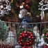 PABest A person wearing a face covering walks passed Christmas wreaths for sale at All Occasions Designer florist in Denny. Eleven local council areas in Scotland are under Level 4 restrictions to slow the spread of coronavirus.