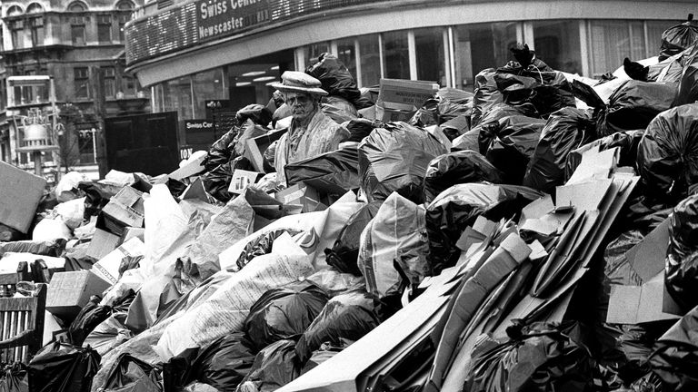 A portrait bust of Sir Joshua Reynolds (centre) looks down with disdain at the rising mound of rubbish in London's Leicester Square. Due to the dustmen's strike, which is in to its 18th day, the square is an official dumping ground and bait put down by council workers has not deterred rats from visiting the dump.