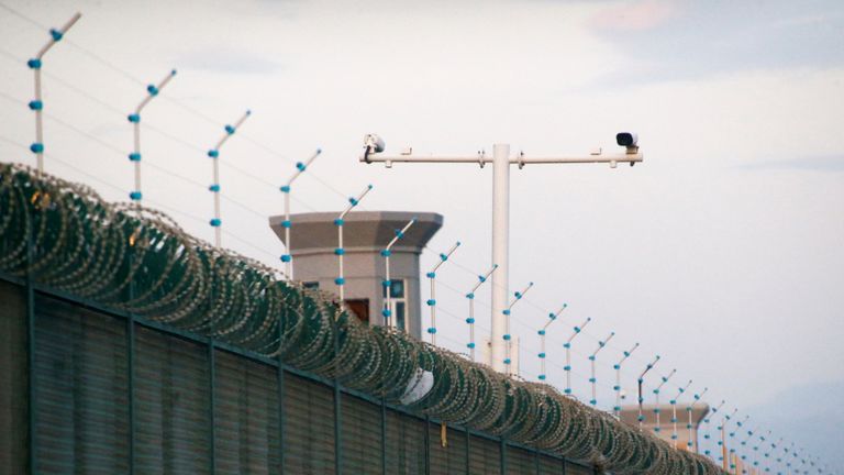 Security cameras are installed above the perimeter fence of what is officially known as a vocational skills education centre in Dabancheng, in Xinjiang Uighur Autonomous Region, China September 4, 2018. This centre, situated between regional capital Urumqi and tourist spot Turpan, is among the largest known ones, and was still undergoing extensive construction and expansion at the time the photo was taken. Picture taken September 4, 2018. To match Special Report MUSLIMS-CAMPS/CHINA  REUTERS/Thomas Peter