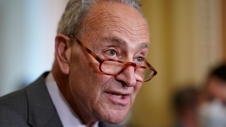 Senate Majority Leader Chuck Schumer, D-N.Y., speaks to reporters after a Democratic policy meeting at the Capitol in Washington, Tuesday, Oct. 5, 2021. President Joe Biden is urging Republican senators to "get out of the way" and let Democrats suspend the nation's debt limit to keep the U.S. government from getting dangerously close to a devastating credit default. (AP Photo/J. Scott Applewhite)