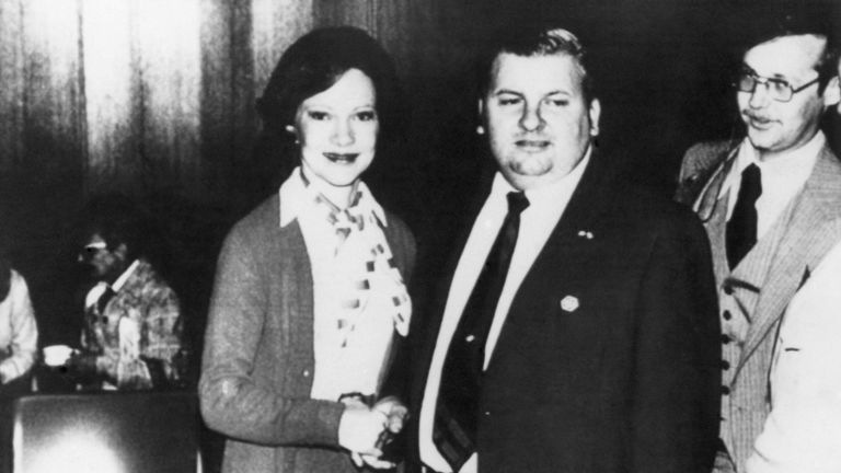 First Lady Rosalynn Carter posed with accused mass murderer John Wayne Gacy Jr. at a private reception in 1978 in Chicago and then autographed the picture, according to a published report by the Chicago Sun Times on January 21, 1979. The photograph is signed, "To John Gacy, Best Wishes - Rosalynn Carter." Man on the right is believed to be Mrs Carter's advance agent. (AP Photo/Chicago Sun Times)