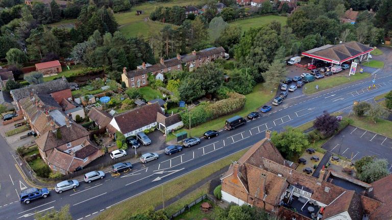 Motorists line up for fuel at an Esso gas station in Ashford, Kent.  Photo date: Monday, October 4, 2021.