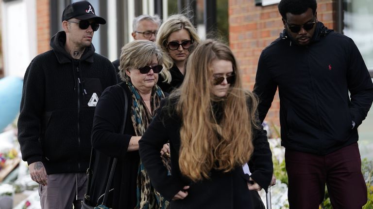 Julia Amess (second right) the widow of Conservative MP Sir David Amess, arrives with friends and family members to view flowers and tributes left for her late husband at Belfairs Methodist Church in Eastwood Road North, Leigh-on-Sea, Essex, where he died after being stabbed several times during a constituency surgery on Friday. Picture date: Monday October 18, 2021.