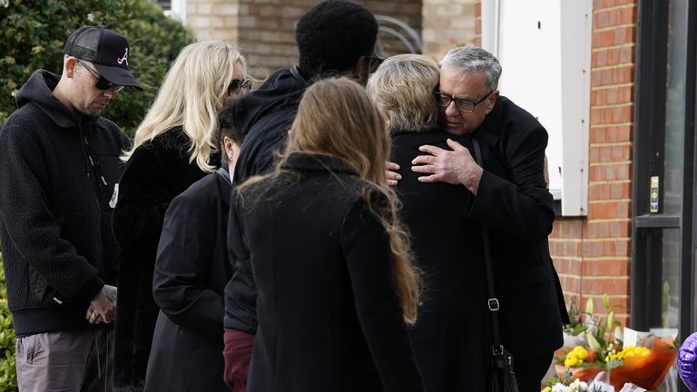 The Rev Clifford Newman of Belfairs Methodist Church, hugs Julia Amess the widow of Conservative MP Sir David Amess, during a visit with friends and family members to view flowers and tributes left for her late husband at the church in Eastwood Road North, Leigh-on-Sea, Essex, where he died after being stabbed several times during a constituency surgery on Friday. Picture date: Monday October 18, 2021.