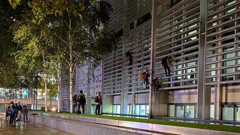 The protesters started climbing up the side of the Home Office at 6am on Tuesday. Pic: Matt Grant